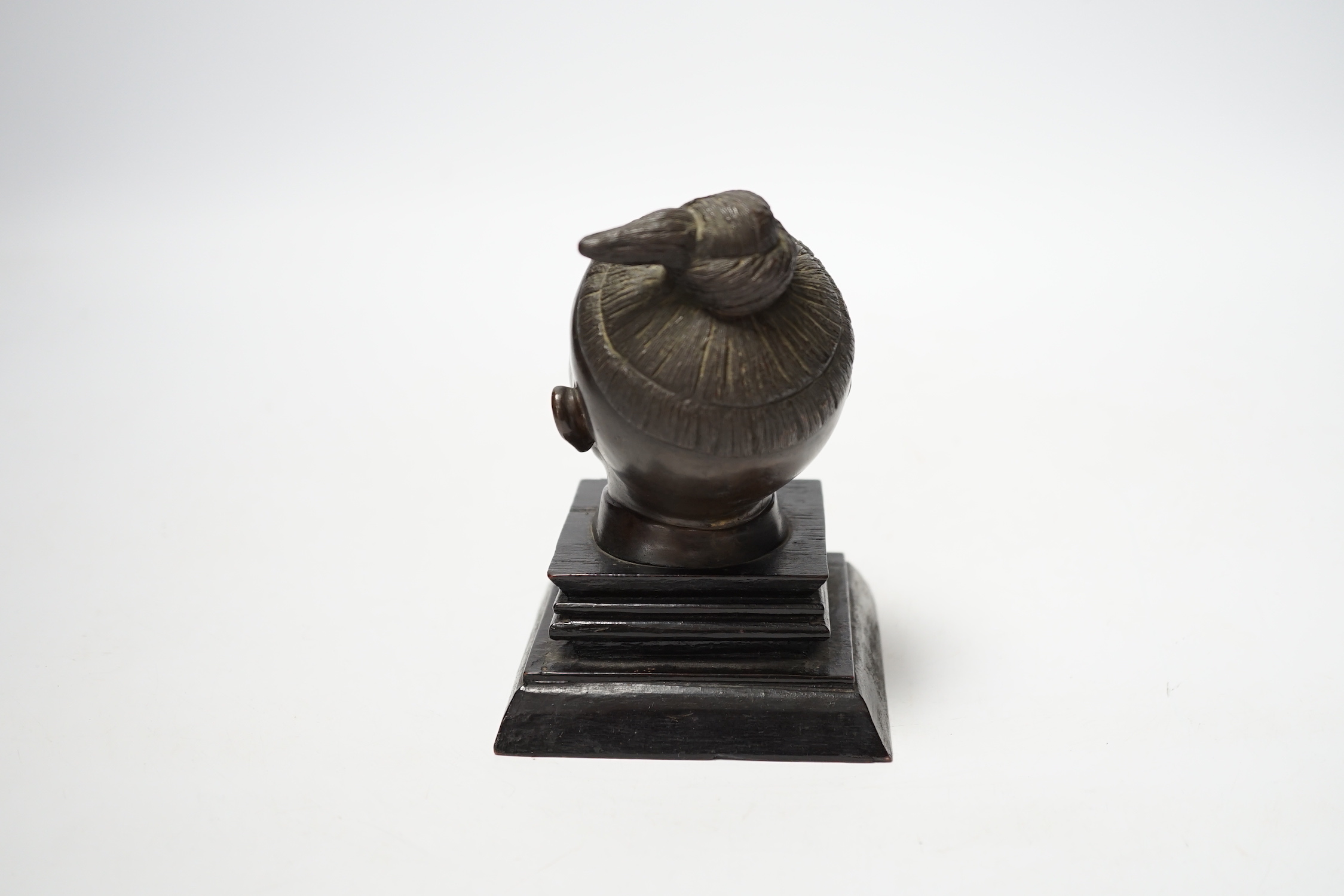 A Malaysian bronze head of a boy, 12.5cm high